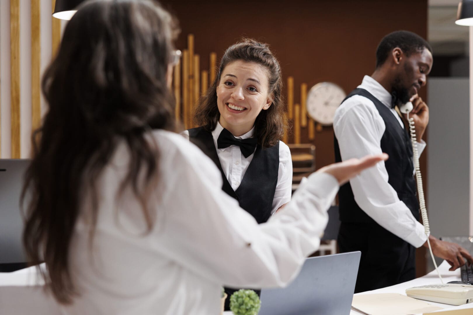concierge-assists-with-check-in-at-hotel